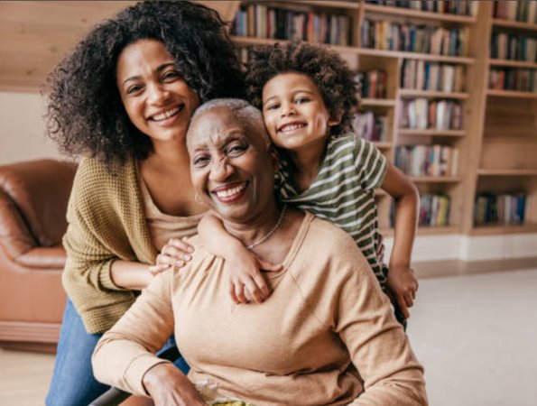 Two women and a child smiling together